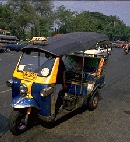 [Clean electric mopedcabs
like this are used throughout the Kingdom of the Golden Mountain]